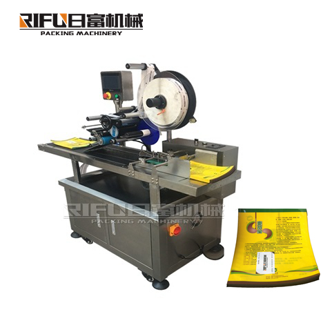 Automatic top and bottom labeling machine with wrap around device
