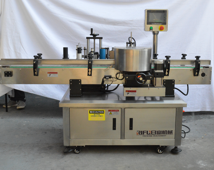 Automatic high speed round bottle labeller