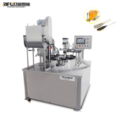 Fully automatic rotary table type honey spoon filling sealing machine