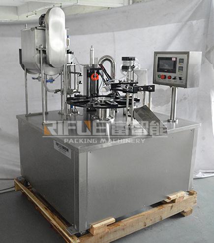 Fully automatic rotary table type honey spoon filling sealing machine