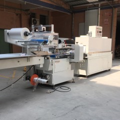 Pillow type heat shrink packing machine