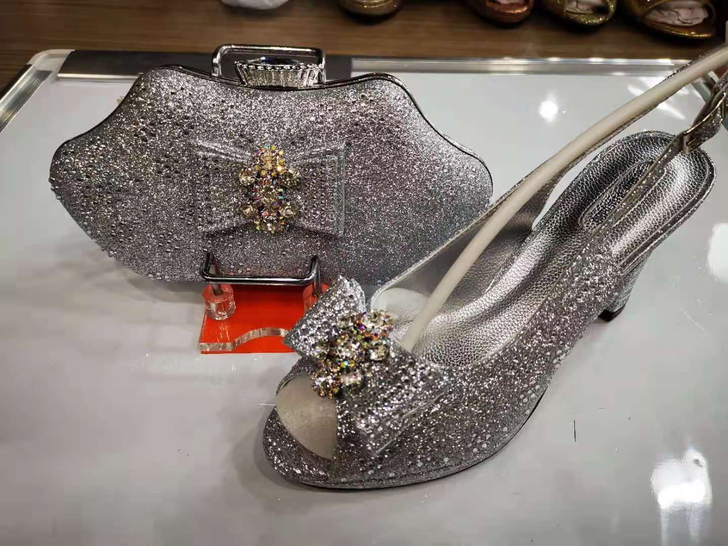 silver shoe and purse