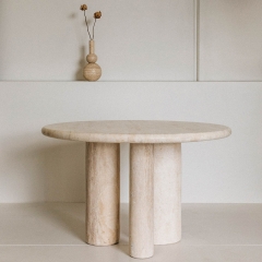 Travertine dining table with Three column-like legs