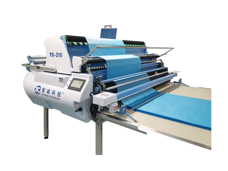 Automatic spreading machine for woven