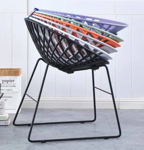 colorful sitting plastic chair with net holding