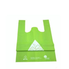 El supermercado biodegradable compostable amistoso de eco le agradece que hace compras el bolso plástico reciclable de la camiseta