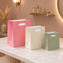 Custom Luxury Matte Kraft Paper Cosmetic Bags with Ribbon Handles for Perfume Skincare Gift Packaging