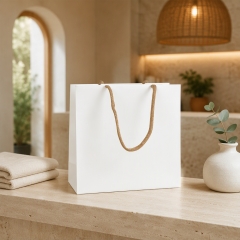 Custom Luxury Matte Kraft Paper Cosmetic Bags with Ribbon Handles for Perfume Skincare Gift Packaging
