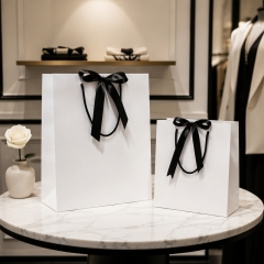 Custom Luxury Matte Kraft Paper Cosmetic Bags with Ribbon Handles for Perfume Skincare Gift Packaging