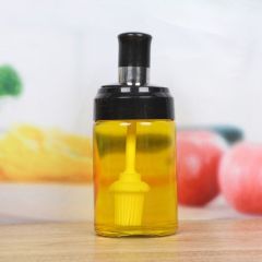 Glass bottle with Spoon, oil brush and honey spoon