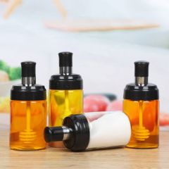 Glass bottle with Spoon, oil brush and honey spoon