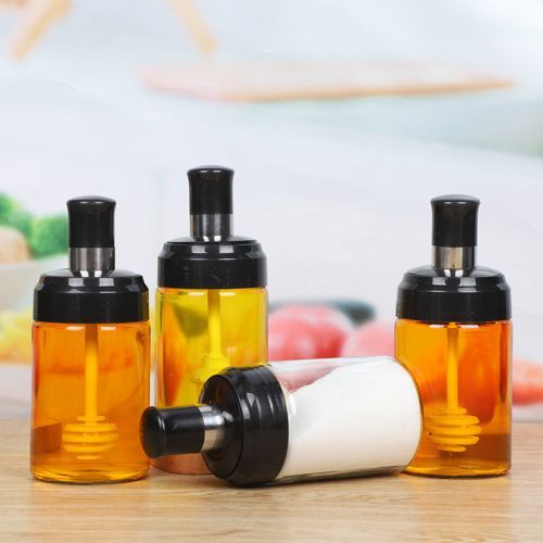 Glass bottle with Spoon, oil brush and honey spoon