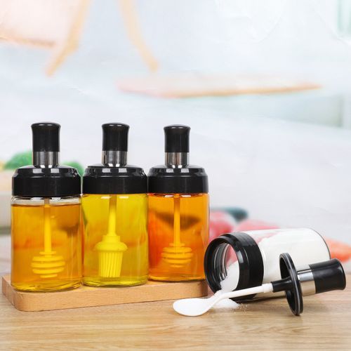 Glass bottle with Spoon, oil brush and honey spoon