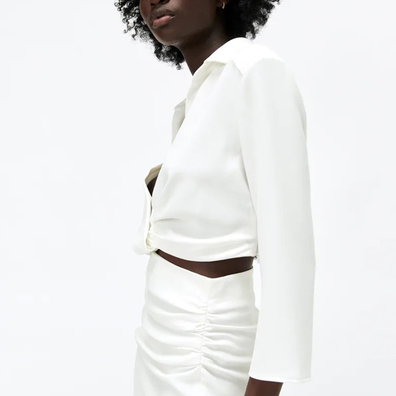 Short shirt with pleated decoration