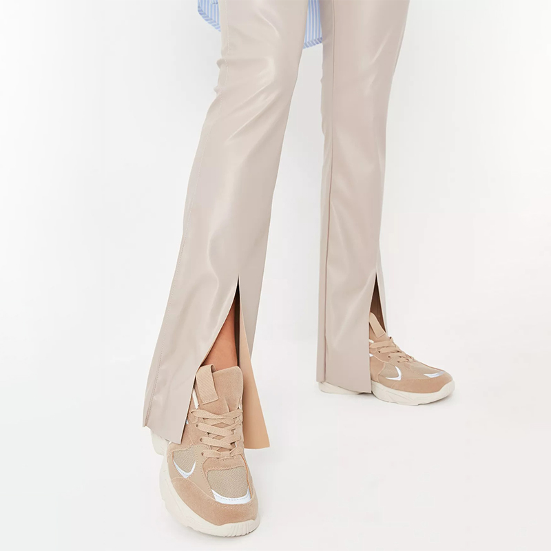 cream faux leather split hem flared trousers