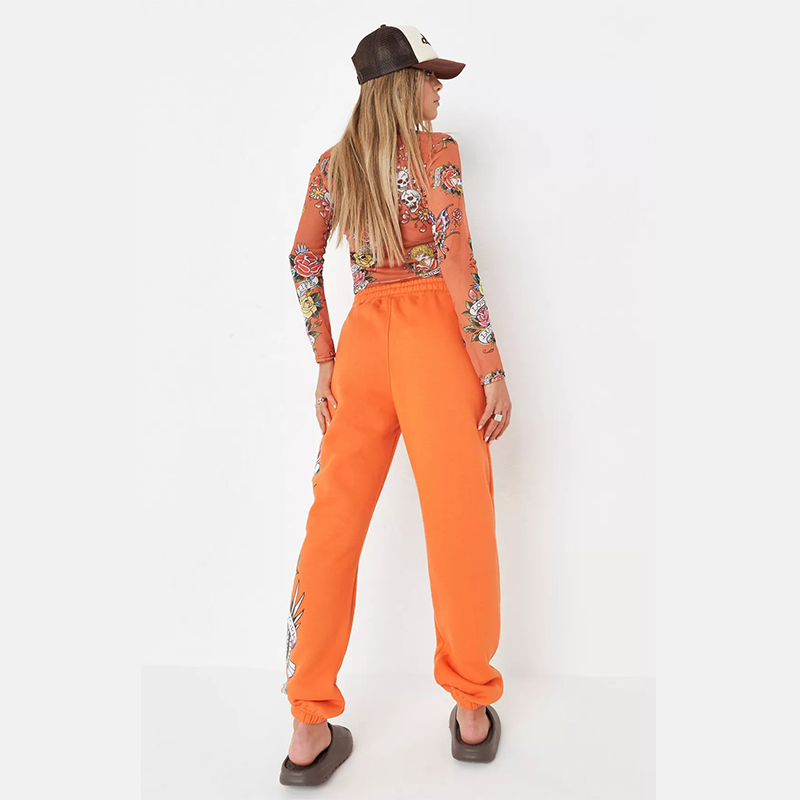 x missguided orange graphic oversized joggers
