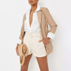 cream faux leather belted shorts