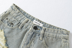 Women's burred and perforated denim shorts