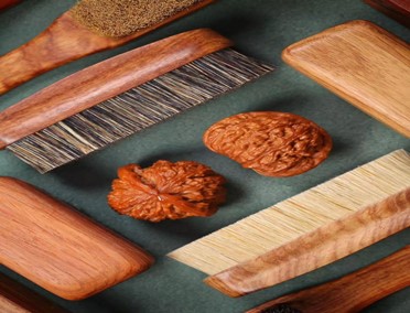 Why do Wenwan brushes use boar bristles?