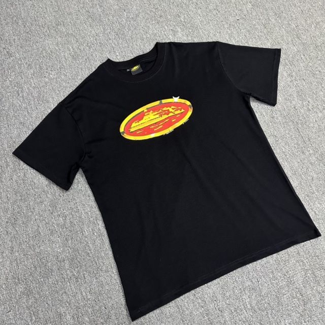 Corteiz gold and red badge tee white black