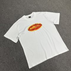 Corteiz gold and red badge tee white black
