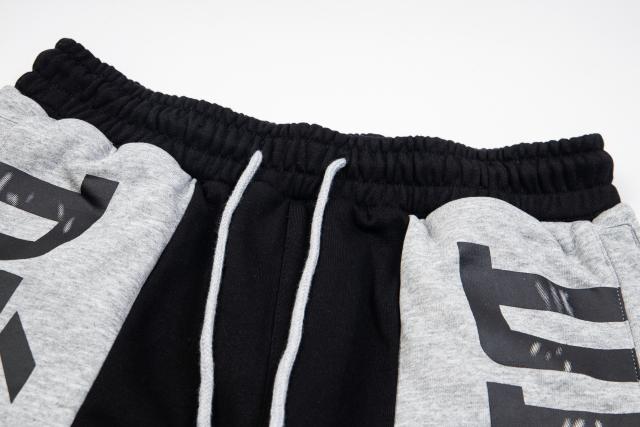 Black and gray spliced logo drawstring shorts