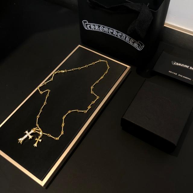 Double cross necklace full of diamonds-