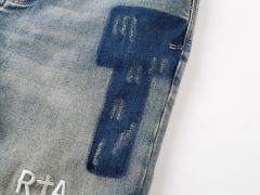 Embroidered Letter Splatter-Print Jeans 28750111