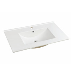 Bathroom white bright ceramic basin with thin edges installed on the cabinet