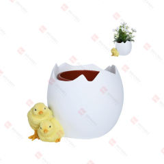 RESIN EGGSHELL PLANTER WITH CHICKS