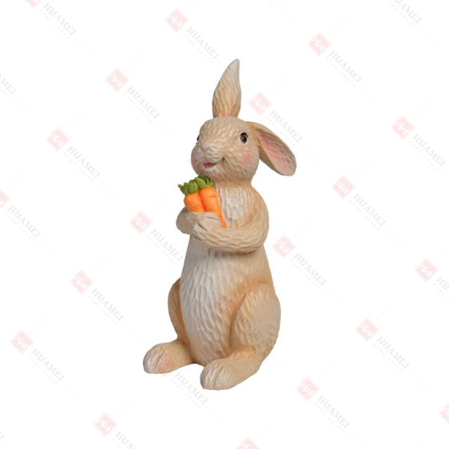RESIN BUNNY HOLDING  TWO CARROTS TABLE DECO