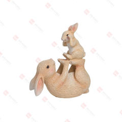 RESIN BUNNY BABY SITTING ON MOM'S FEET TABLE DECO