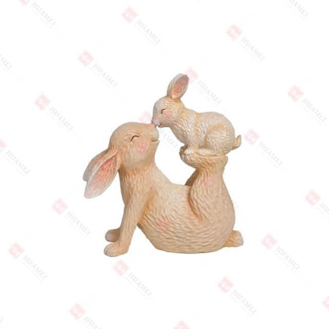 RESIN BUNNY BABY STANDING ON MOM'S FEET TABLE DECO