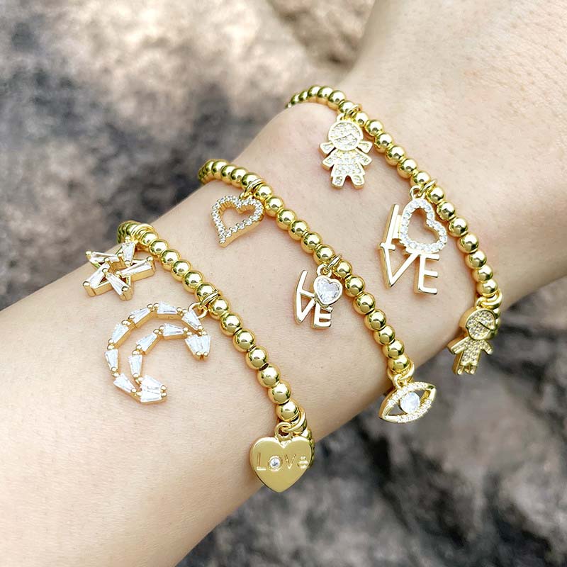 Wholesale Selling Love Eyes Round Beads Gold Plated Elastic Bracelet Star Moon Boy Girl Bracelet Vendors