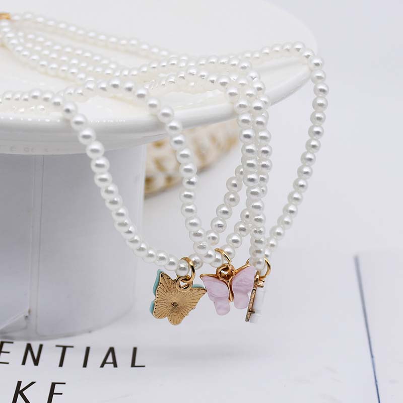 Wholesale Cat's Eye Stone Bow Pearl Necklace Design Sense Of Fashion