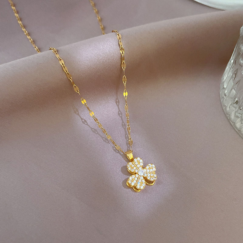 Titanium Steel Light Luxury Full Diamond And Zirconia Rotating Clover Necklace Copper Plating Real Gold Pendant Manufacturer