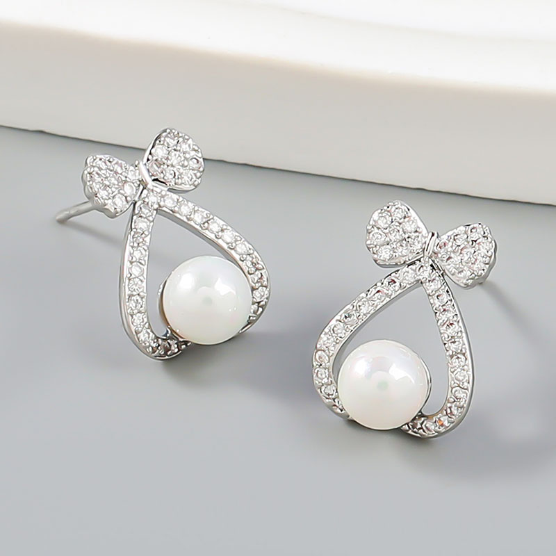 Wholesale Fashion Simple Alloy With Diamonds And Pearls Love Bow Korean Earrings