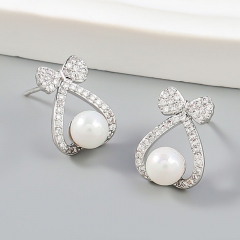 Wholesale Fashion Simple Alloy With Diamonds And Pearls Love Bow Korean Earrings
