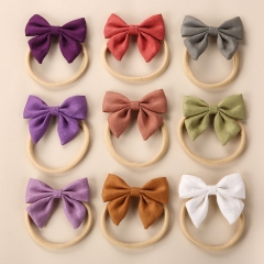 Linen Solid Colour Three-dimensional Bow Nylon Baby Hairband Supplier