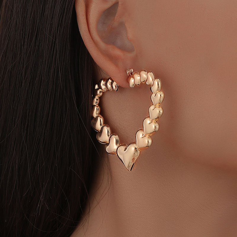 Simple Metal Hollow Three-dimensional Heart-shaped Glossy Vintage Earrings Supplier