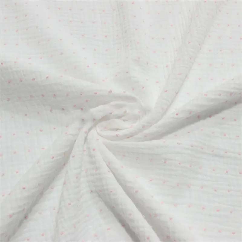 off white muslin fabric dotted