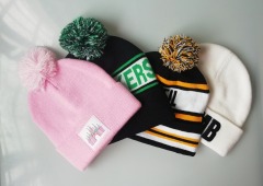 Pink bom bom beanie hat with printing label