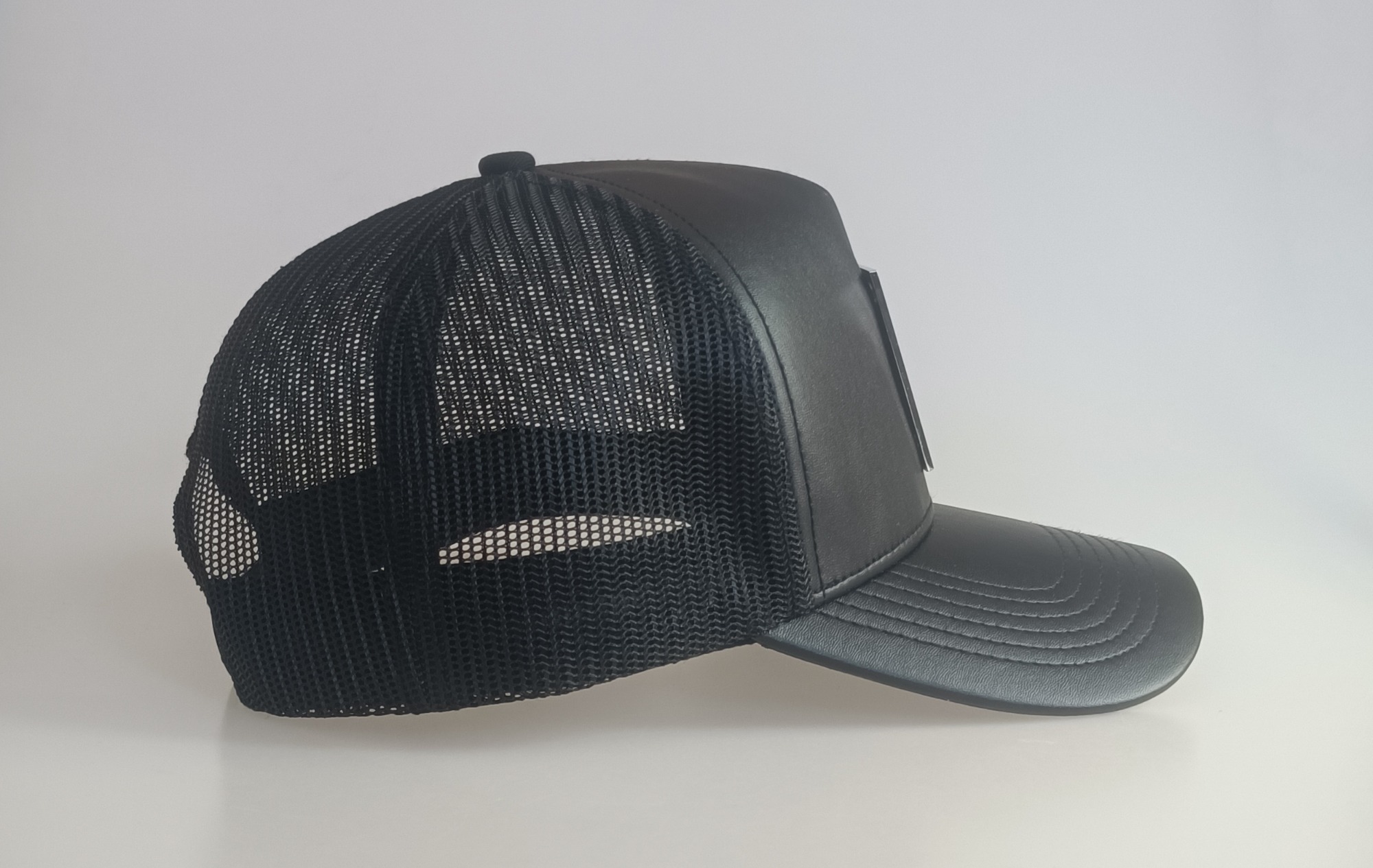 Custom black leather mesh hat metal patch logo high quality trucker cap hat