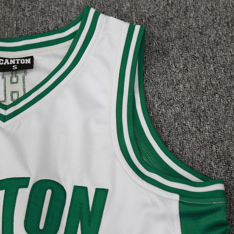 customizable white basketball uniform with embroidered logo