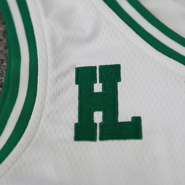 customizable white basketball uniform with embroidered logo