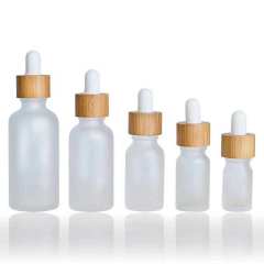 Customized Bamboo Lid Essential Oil Bottles Glass Dropper Bottle with Wooden Cap Cosmetic Empty