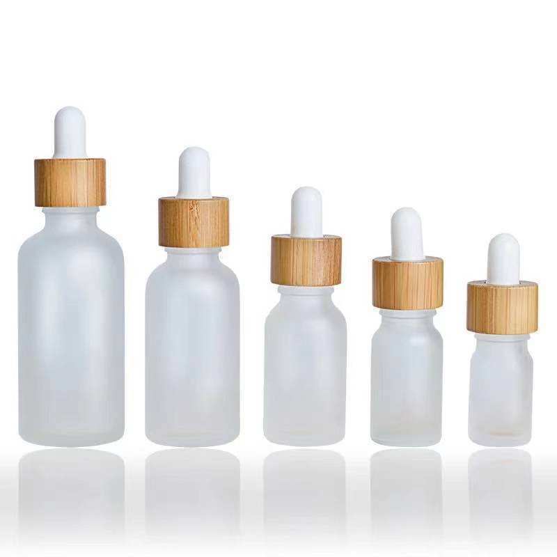 Customized Bamboo Lid Essential Oil Bottles Glass Dropper Bottle with Wooden Cap Cosmetic Empty