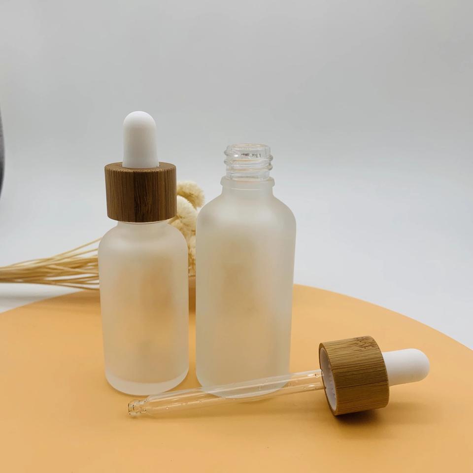 Customized Bamboo Lid Essential Oil Bottles Glass Dropper Bottle with Wooden Cap Cosmetic Empty
