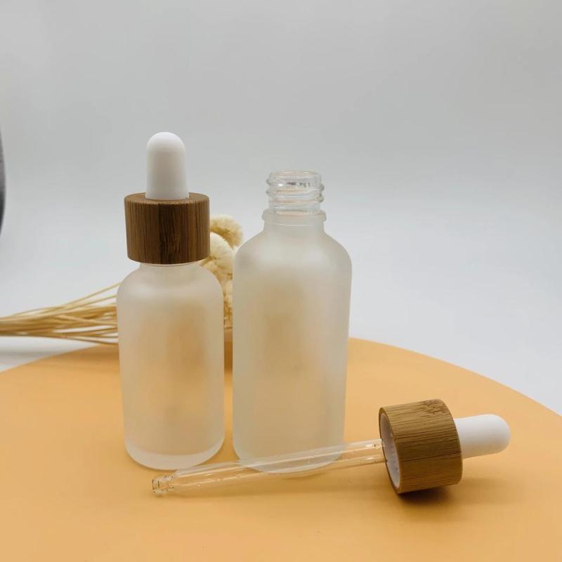 Customized Bamboo Lid Essential Oil Bottles Glass Dropper Bottle with Wooden Cap Cosmetic Empty