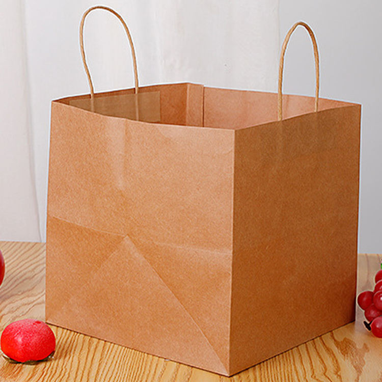 Healthy platter takeaway divided chicken pieces and French fries packed lunch box double kraft paper food packaging